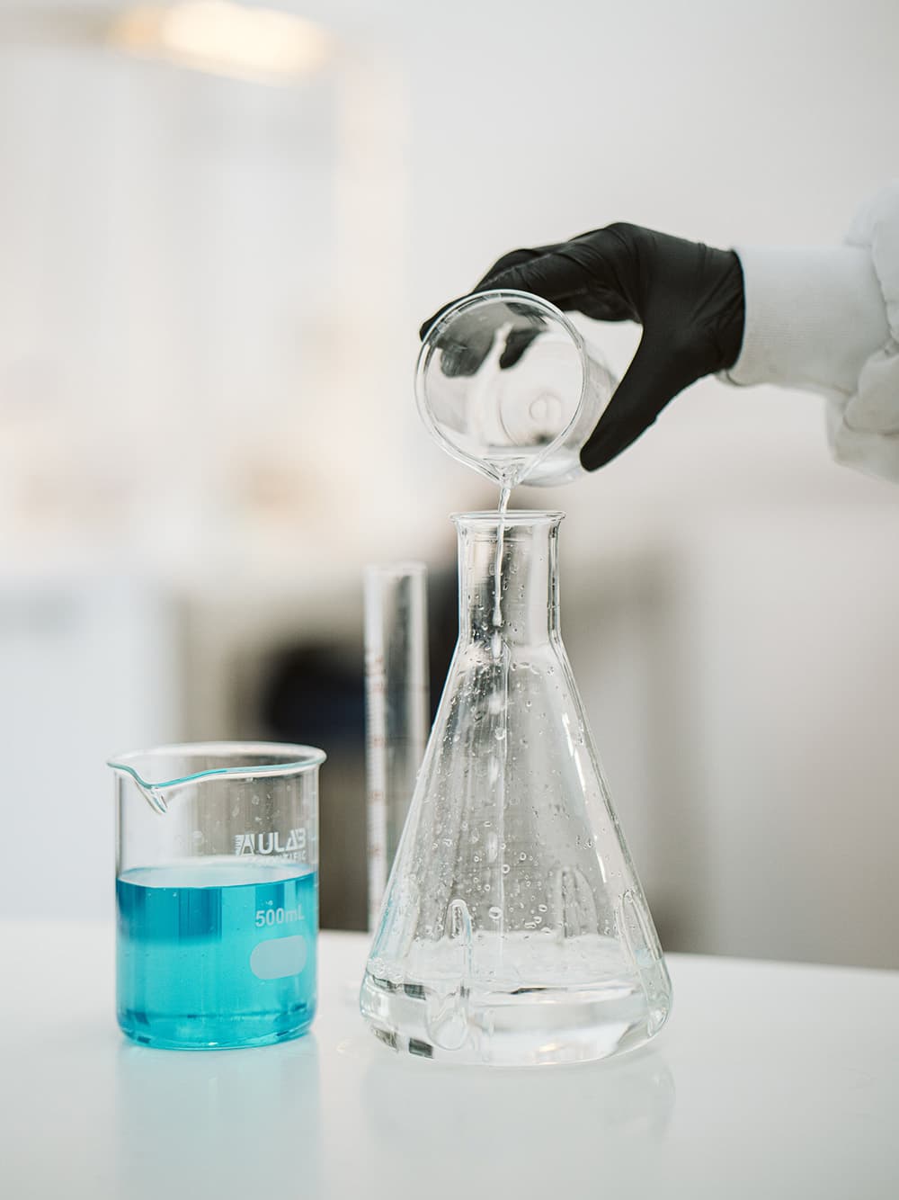 Green chemistry: chemicals being mixed in a biotechnology lab for use in making biomaterials with bacteria